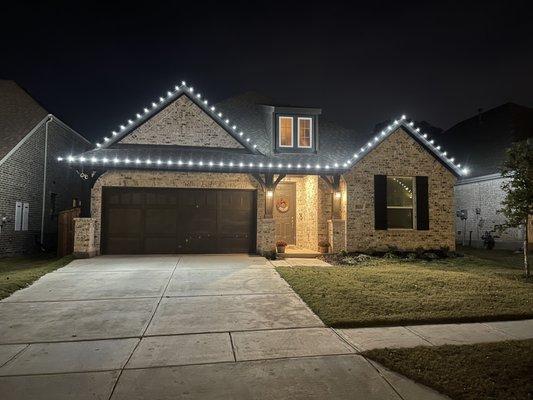 Pure white Christmas lights, corner to corner.