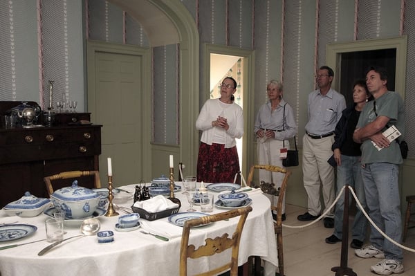 Visitors on tour in the dining room of the Williams House.