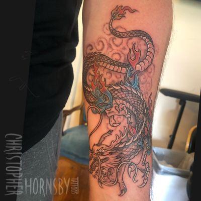 Dragon on forearm By Chris Hornsby