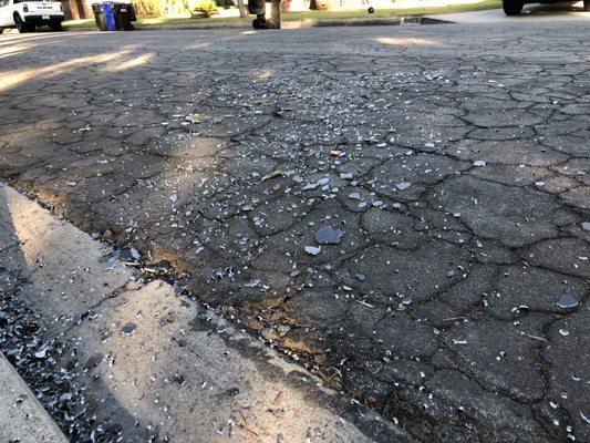 Broken glass that Calmet left behind after picking up my neighbor's trash, across our driveway front house and other neighbors house.