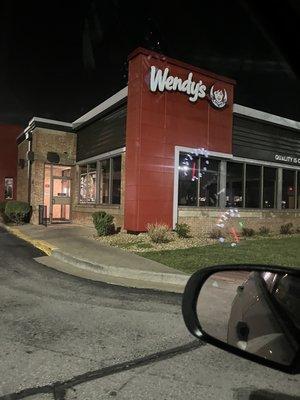 A dark fast food place that says they are open until 1am... i mean its friday not a Sunday.