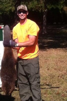 Jarrod Jr. with a 50 lb. beaver he caught at a customer's home.