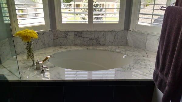 Bath remodel with Calacata marble, undermount tub