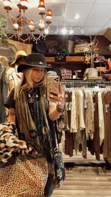 Photo taken inside the store, wearing my new hat and necklace! :)