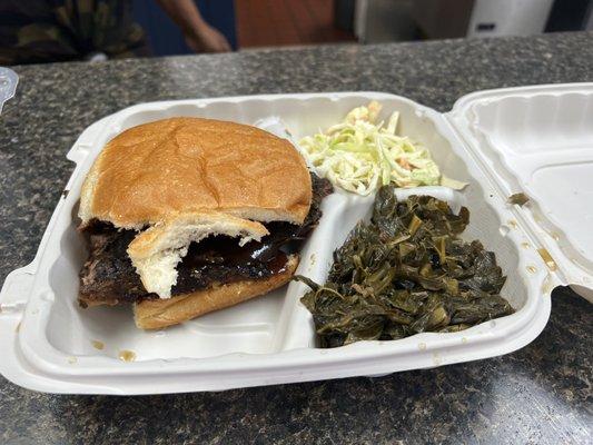 Brisket sandwich with coleslaw and collard greens. To die for!