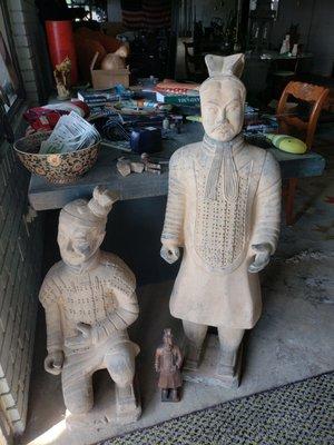 Ancient Asian soldiers standing guard at the door to greet customers.