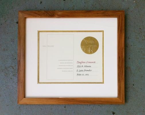 Natural Cypress frame with gold leafed mat.