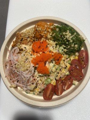 It has spicy tuna, spicy salmon,some mix-ins with spicy Mayo and fresh ponzu sauce and seaweed salad, kani, tomatoes, masago, sesame seeds