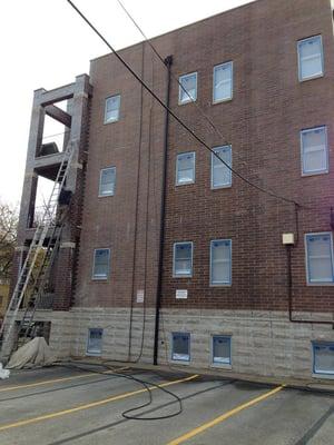 the windows are protected with plastic prior to applying the sealant