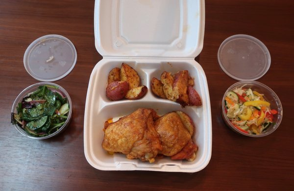 Chef's meal with chicken thighs entree, baked potatoes, and 2 salads; now $4.99.