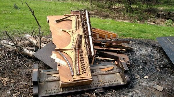 We offer piano disposal, this old piano was in a remolded basement. Piano was removed in pieces and cut in half.