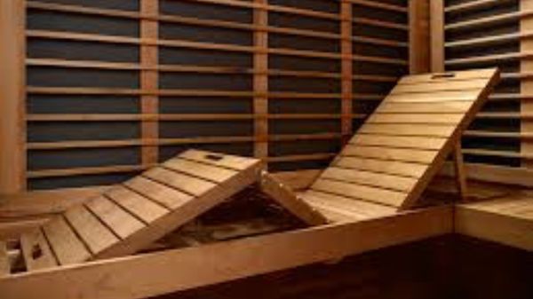 Interior infrared sauna wood recliner bench at Dallas Vitality Clinic in Rowlett, TX