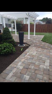 Beautiful pavers, did and shrubbery.