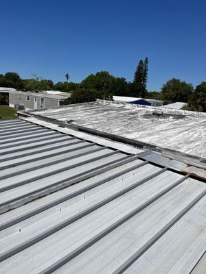 Metal mobile home roof tie in failing. This is about to be a TPO roof to pass wind MIT and 4 pt inspection.