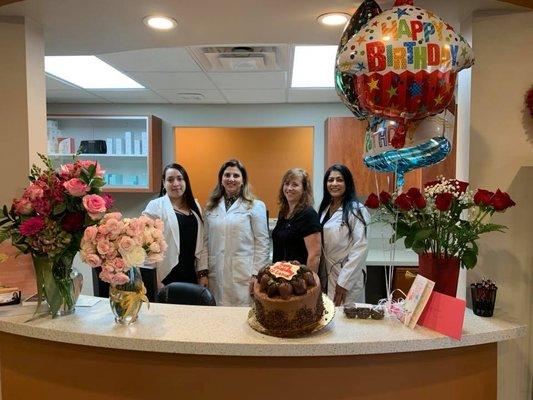 Dr. Daoud celebrating her birthday with the Glo team!