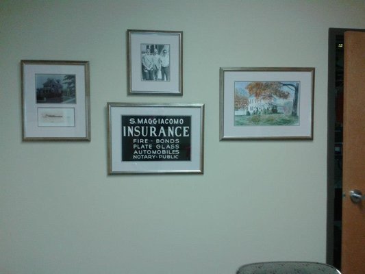 Maggiacomo Insurance conference room with a little bit of history on our gallery wall.