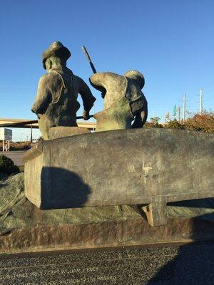 The sculpture even includes some fish in the boat.