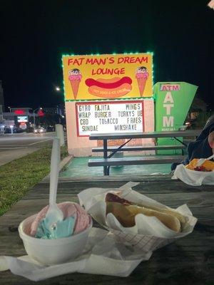 Road sign, cotton candy ice cream, hot dog