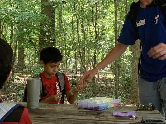 Bead ceremony for character strengths at Camp Blazing Trails 2022.