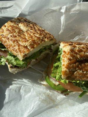 Hot Turkey and provolone sandwich with grilled bell peppers on Dutch crunch