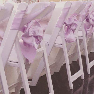 A sash alone looks great on a white wooden chair!