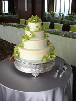 Fresh green orchids on a wedding cake