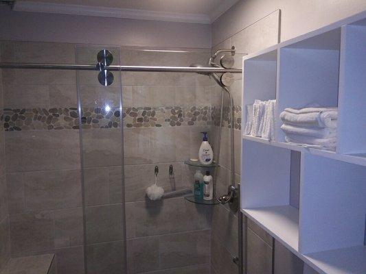 Shower remodel with industrial shower doors.