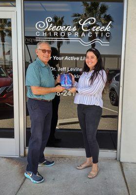 Dr. Levine & Receptionist Cinthia with Dr. Levine's book