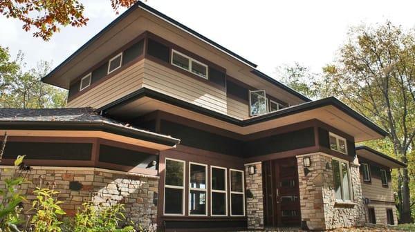 Addition of a 1000sf upper level master bedroom suite to a 1950s split level. Prairie-style detailing of the entire exterior ...