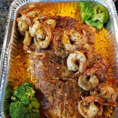 Honey jerk salmon and shrimp over yellow rice