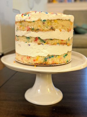 Fun and colorful birthday cake. With lots of creamy frosting and "birthday truffles". Yum.