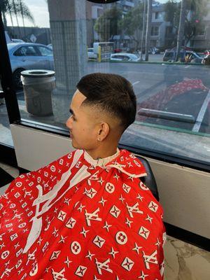 Mid skin fade buzzcut.