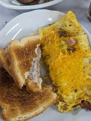 First half of kitchen sink omelet and buttery toast