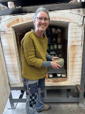 Member Kathy helping to unload the kiln