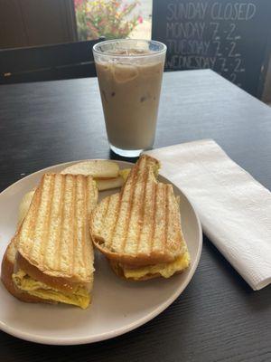 Delicious breakfast sandwich on Challah and iced coffee.