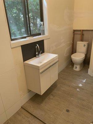 Laundry to bathroom conversion