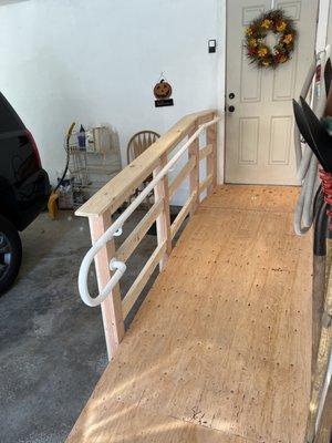 Handicap ramp, for easier access than stairs. sturdy railing with grab bar