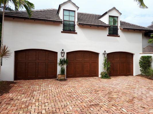 Over head garage doors were faux finished in a wood grain effect.