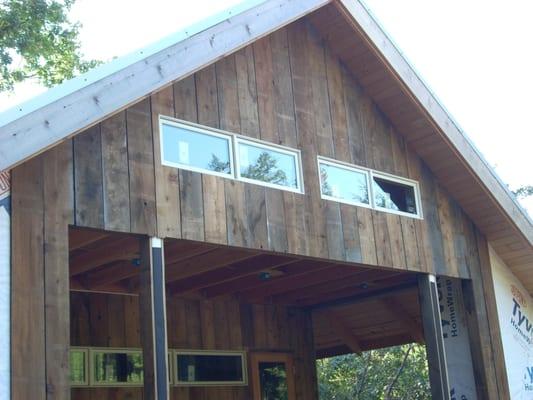 installed windows and doors on this house as well as recycled board & batten siding