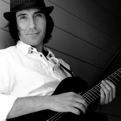 Italian guitarist, ukulele player and multi-instrumentalist.