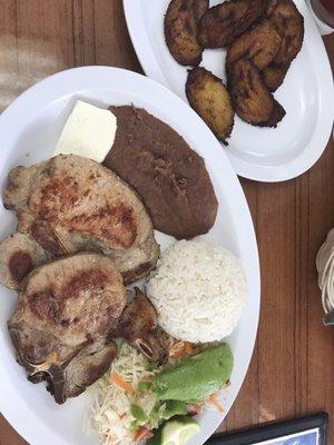 Chuleta with rice, beans, spicy slaw salad and ripe plantains!