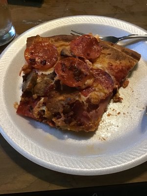 Slice of meat lovers pizza