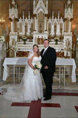 My husband and I in front of the alter.