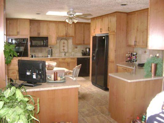 Custom made frameless cabinets in Alder & Ash, quartz tops with new floor & backsplash tile