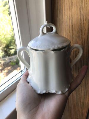 A darling china pot that I bought from King's Row Antiques. I use it to store my sugar for making tea.