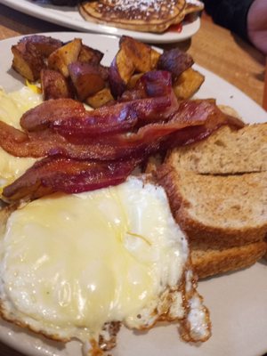 2 eggs bacon home fries toast