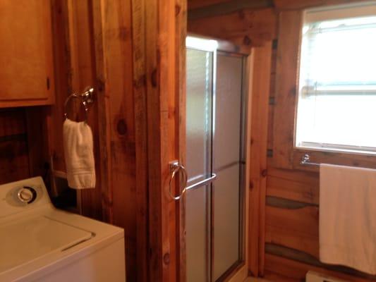 Full size bathroom has walk-in shower and washer & dryer for guest use