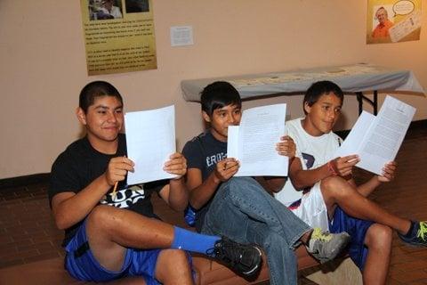 Three young men from Roscoe working hard on a museum project.