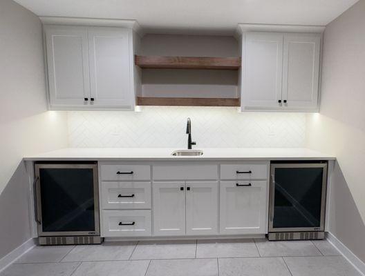 A modern wet bar with custom shelving!