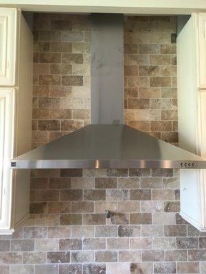 Installed a custom range hood in a brand new home.